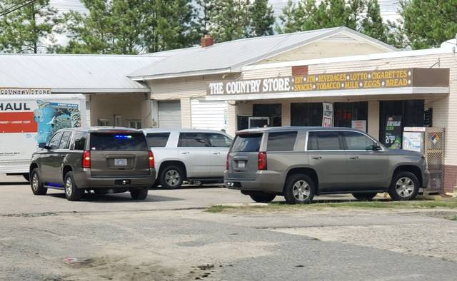 
			
				                                Contributed photo
                                ALE vehicles parked outside The Country Store as part of a raid on illegal gambling machines Thursday.
 
			
		