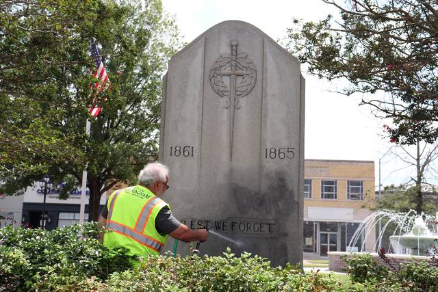 
			
				                                Neel Madhavan | Daily Journal
                                Public works staff cleans black spray paint off of monument in Harrington Square in downtown Rockingham Saturday afternoon.
 
			
		