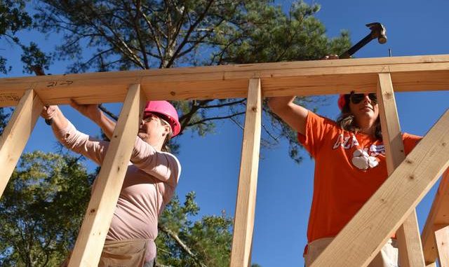  Courtesy photo United Way volunteers work on a Habitat for Humanity build in 2019. United Way is participating in another Habitat build this year during the agency’s Days of Caring. 