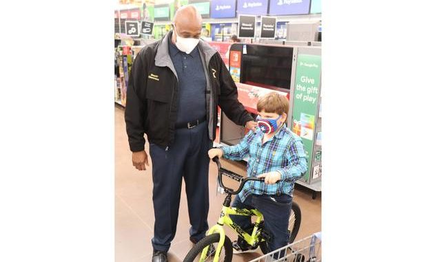
			
				                                Sheriff James Clemmons greets a boy who wanted a bike. Deputies with the Richmond County Sheriffs Office took a group of kids on holiday shopping sprees Saturday as part of its first ever Shop with a Deputy event.
 
			
		