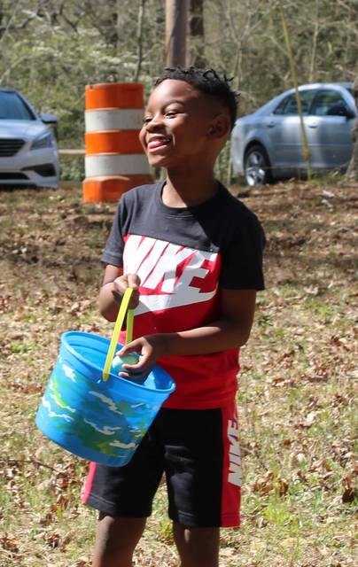 <p>Gavin Stone | Daily Journal</p> <p>Tayben Thompson, 6, celebrates after finding another Easter egg on Sunday. </p>