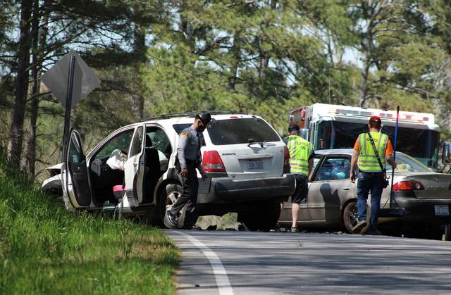 <p>Gavin Stone | Daily Journal</p> <p>Trooper I. Shaw examines a wreck on Ledbetter Road Sunday afternoon.</p>