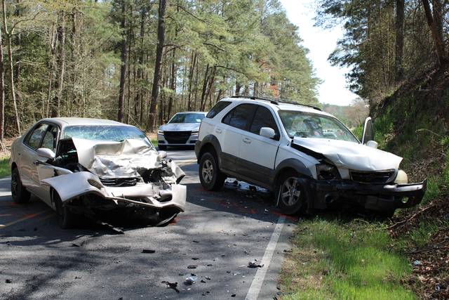 <p>Gavin Stone | Daily Journal</p> <p>The Corolla on the left allegedly crossed the center line while headed east on Ledbetter Road and collided head-on with the white Kia. Six people were hospitalized, though their injuries are not believed to be serious.</p>