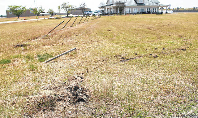 
			
				                                
			
				                                
			
				                                
			
				                                Gavin Stone |  Daily Journal This is the impact point to the left of the runway entrance where the suspect hit the fence.  The bars of the fence were bent backwards from the impact.
 
			
		