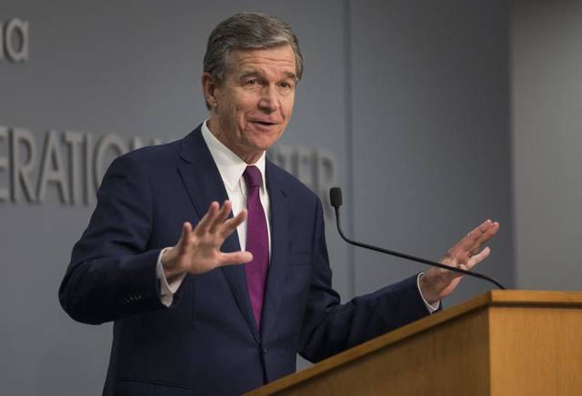 Julia Wall | The News & Observer via AP
                                North Carolina Gov. Roy Cooper speaks to reporters during a COVID-19 news conference at the state Emergency Operations Center in Raleigh, N.C. on Wednesday, July 21, 2021.