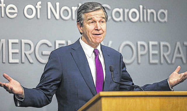  Julia Wall | The News & Observer via AP North Carolina Gov. Roy Cooper speaks to reporters during a COVID-19 news conference at the state Emergency Operations Center in Raleigh, N.C. on Wednesday, July 21, 2021. 