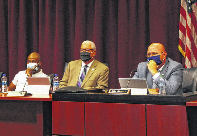 Gavin Stone | Daily Journal
                                From left, Commissioners Tavares Bostic and Rick Watkins, and Chairman Jeff Smart wear masks in the Board of Commissioners regular monthly meeting room in the Richmond County Judicial Center for the first time since they returned to in-person meetings.