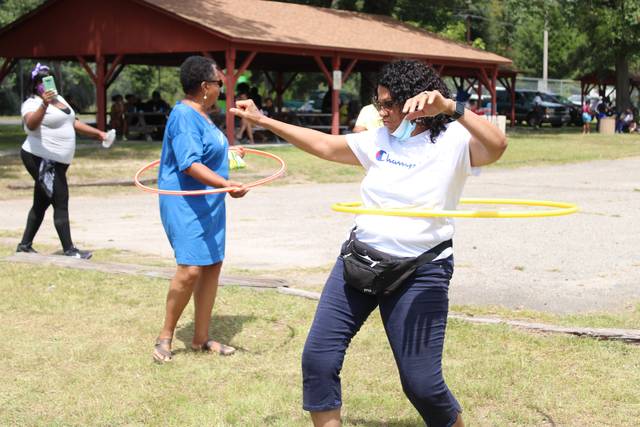 <p>Shirlyn Morrison-Sims, the organizer of the Community Safe event, pushes to win the hula hoop contest on Saturday.</p> <p>Gavin Stone | Daily Journal</p>