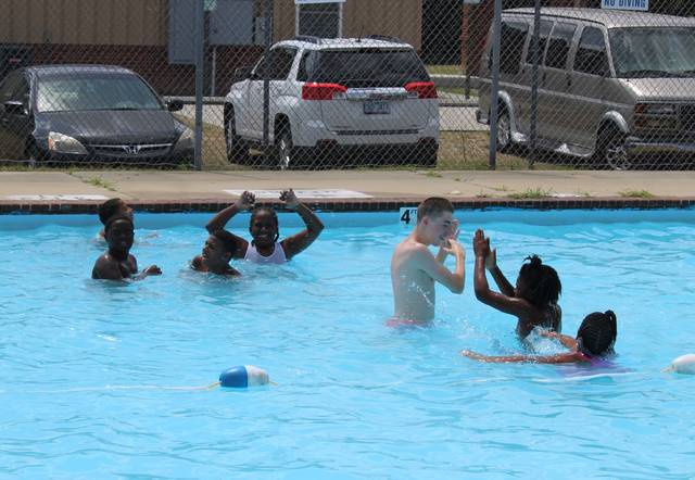 <p>Children play in the Dobbins Heights pool on Saturday.</p> <p>Gavin Stone | Daily Journal</p>