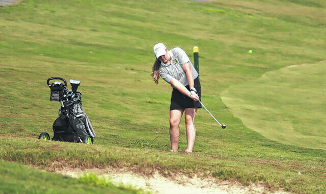  Abigail Tatum hits out of the rough near the 18th green at Foxfire on Sept. 13. Neel Madhavan | Daily Journal 