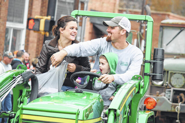 
			
				                                Farming families ride together down Main Street in Ellerbe during the 2014 Farmers’ Day Parade.
 
			
		
