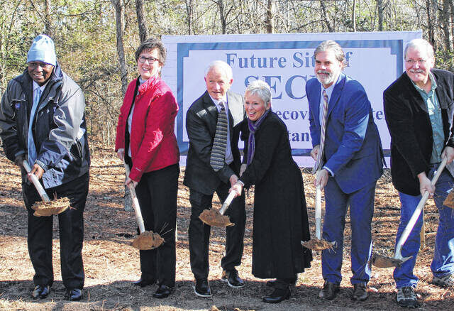 In the center, Harold and Constance Pearson “break ground” on the SECU Women’s Recovery Center alongside Samaritan Colony Board of Directors members (from left) Phill Ford, Angie Averitte, Clint Ray and Dr. Robert Townsend.
                                 Gavin Stone | Daily Journal