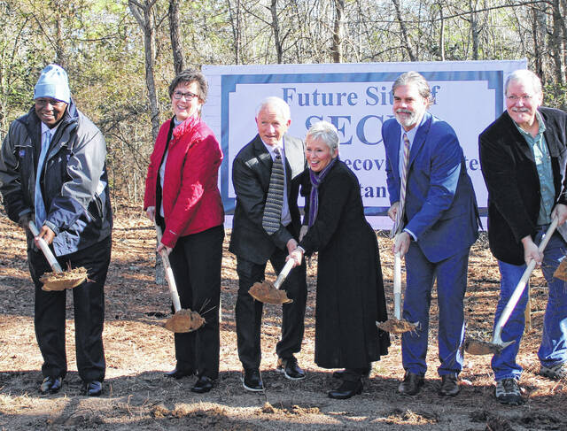 
			
				                                In the center, Harold and Constance Pearson “break ground” on the SECU Women’s Recovery Center alongside Samaritan Colony Board of Directors members (from left) Phill Ford, Angie Averitte, Clint Ray and Dr. Robert Townsend.
                                 Gavin Stone | Daily Journal

			
		
