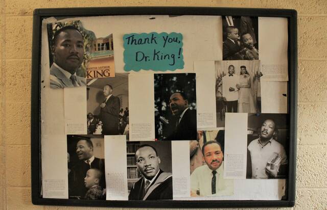 Gavin Stone | Daily Journal
                                A poster board honoring Dr. Martin Luther King Jr. displayed in the main hallway of the James C. & Ruth P. Watkins Cultural Center.