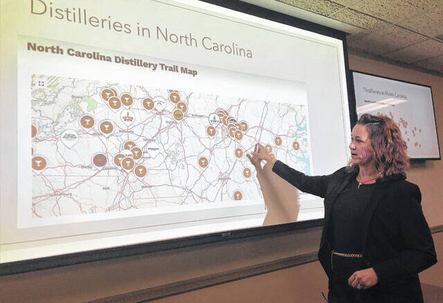 Lisa Lowery shows a map of the distilleries in North Carolina. Richmond County is at the lower middle of the map, which is far from any distillery. The nearest is in Southern Pines.
                                 Gavin Stone | Daily Journal
