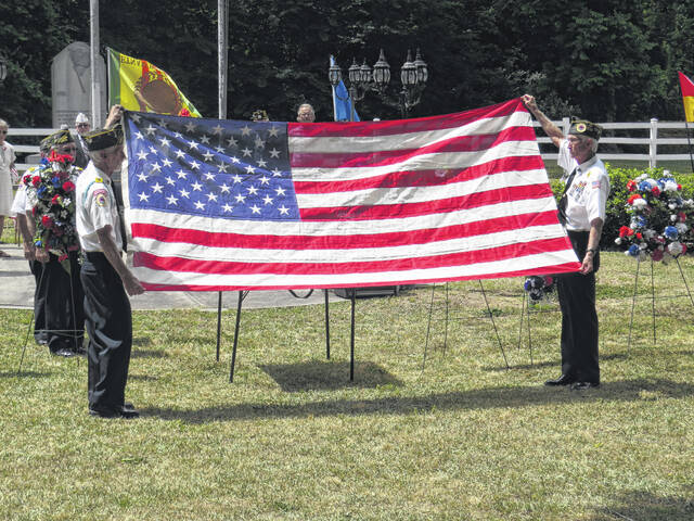 
			
				                                A flag folding ceremony at the 2021 Memorial Day ceremony, which drew participants from VFW Post 4203, American Legion Post 147 and AMVETS.
 
			
		