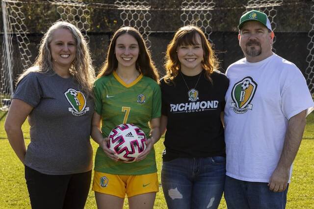Heather, Evie, Kylie, and Mark Howell stand for a photo at the Richmond Senior High School soccer field for a three-year celebration photo of Evies battle with POTS.
                                 Photo courtesy of Mark Bell