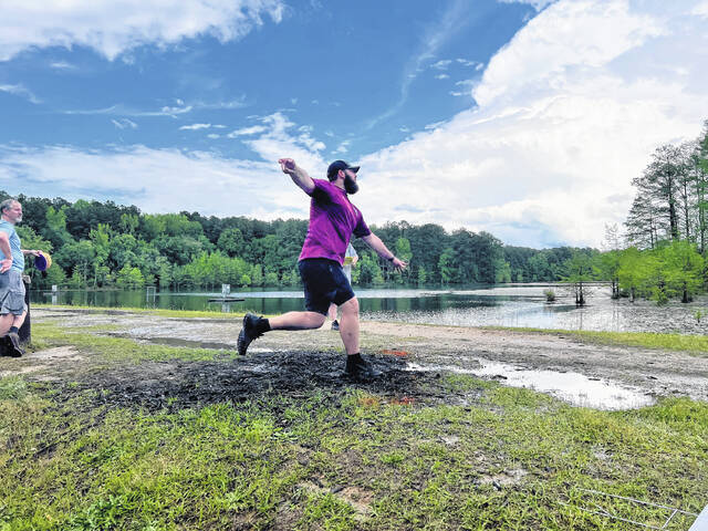 <p>Tournament Director Chris McDonald launches a throw on Hole 19 at Hinson Lake.</p>
                                 <p>Photo courtesy of Jimmy McDonald</p>