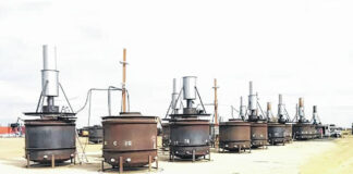 
			
				                                This picture shows an example of a row of pyrolysis kilns that will be used to produce biochar in a similar setup to what will be used by ITD.
                                 Photo courtesy of NCDEQ

			
		