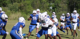 
			
				                                St. Andrews’ Will Gordon (14) gets tackled by a pair of defenders during Saturday’s spring football game at Knights Field in Laurinburg.
                                 Brandon Hodge | The Laurinburg Exchange

			
		